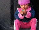 4 adorable child fascinated with a broken balloon